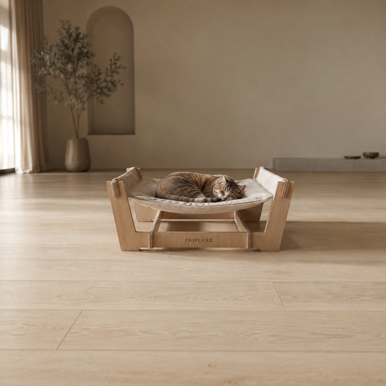 The SWIFT sling bed, its linen sling between birch uprights, made in Egypt by PawLuxe.