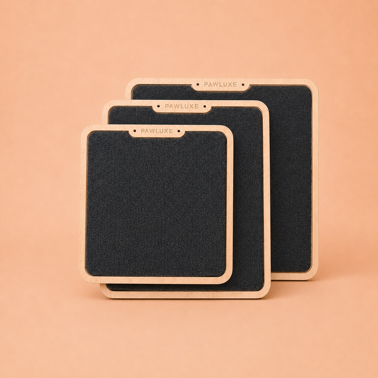 The three PawLuxe TERRA sizes shown together on a plain background, small, medium and large birch-framed carpet boards.